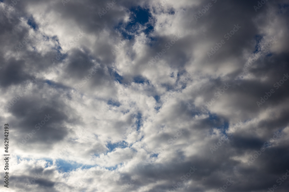 Sky covered with clouds with glimpses of sunbeams