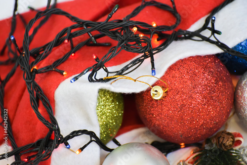 Christmas balls with led garland on white background  Christmas decorations . New year design and space for text. New year 2022