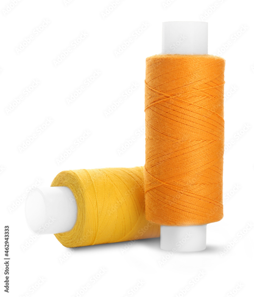 Different colorful sewing threads on white background Different colorful sewing threads on white background