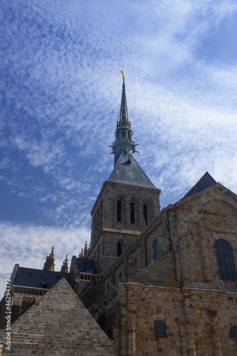 View on the abbey church tower in front of blue sky. Mont Saint Michel / Normandy / France