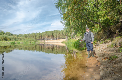 Fisherman on the bank of a beautiful river.