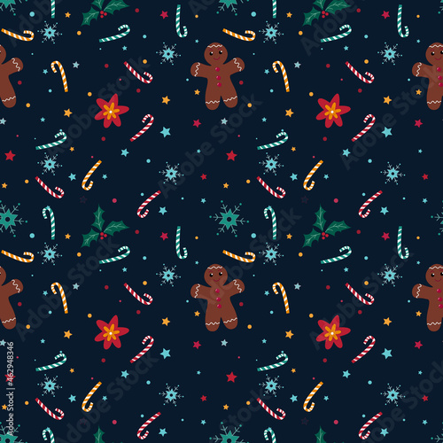 Christmas seamless pattern with snowflakes, candy, christmas star, holly and gingerbread man on blue background