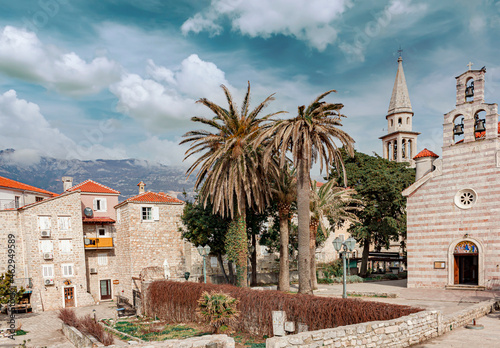 Palm Trees, Church and Stone Architecture  photo