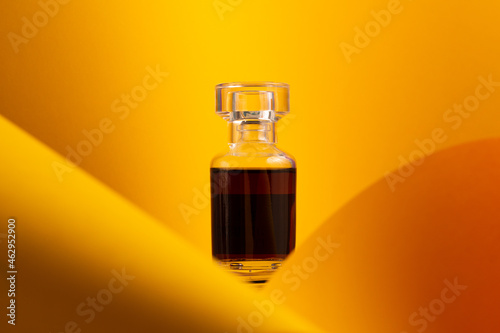 Perfume bottle on orange and bright background