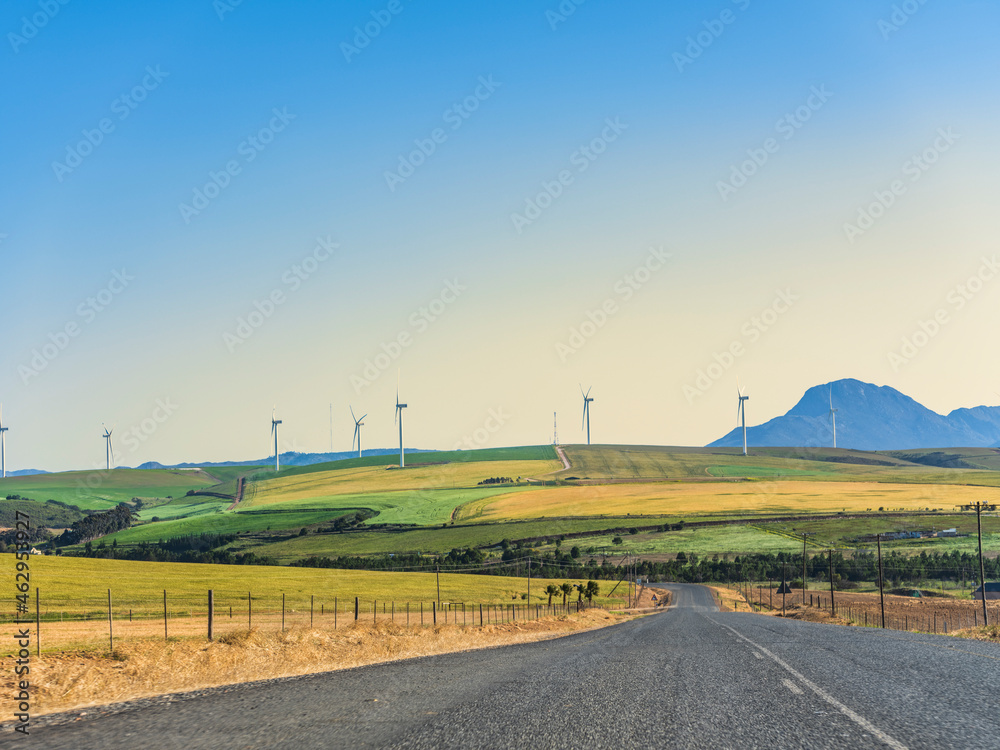 Colourful rolling hills and wind turbine in the overberg valley in western cape South Africa