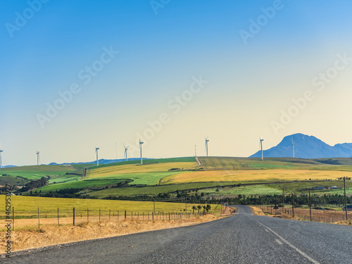 Obraz na płótnie Colourful rolling hills and wind turbine in the overberg valley in western cape South Africa w salonie