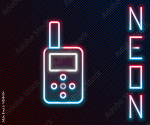 Glowing neon line Baby monitor walkie talkie icon isolated on black background. Colorful outline concept. Vector