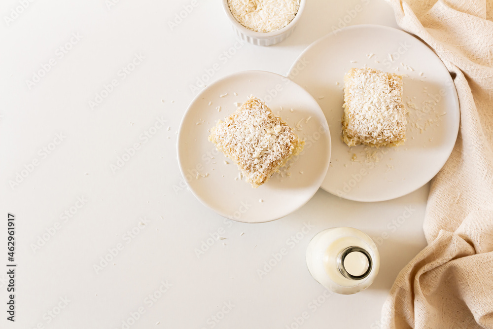Breakfast beige cozy composition with coconut cake. Flat lay, top view Breakfast beige cozy composition with coconut cake. Flat lay, top view