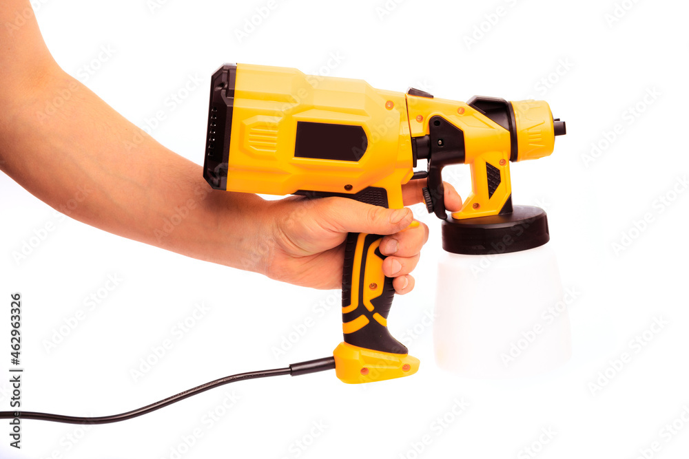 paint gun holding by mans hand isolated on white background - Image paint gun holding by mans hand isolated on white background - Image