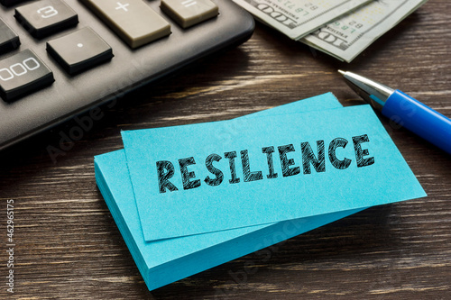 Financial concept about RESILIENCE with sign on the piece of paper.