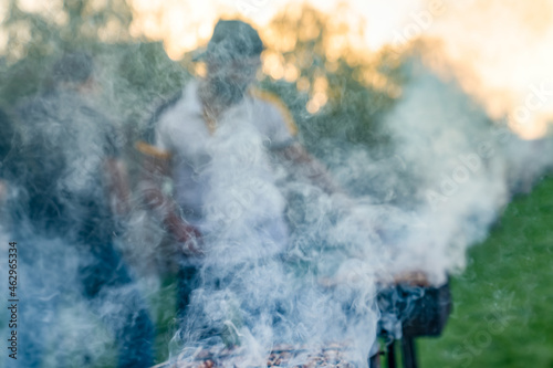 View of barbecue under heavy smoke. Blurred view of barbecue.
