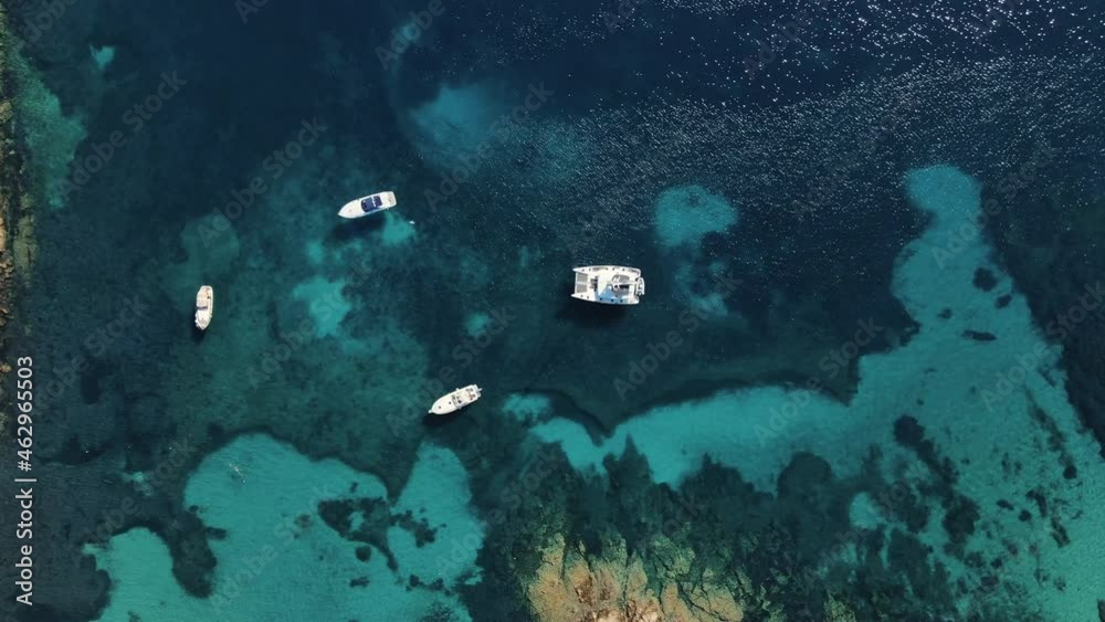 secret sea shore spot with clear water ideal for heartfelt excursion. Boats and sailboats anchor in the little inlet. Heaven scuba jumpers. drone sideways, north Sarinia secret sea shore spot with clear water ideal for heartfelt excursion. Boats and sailboats anchor in the little inlet. Heaven scuba jumpers. drone sideways, north Sarinia