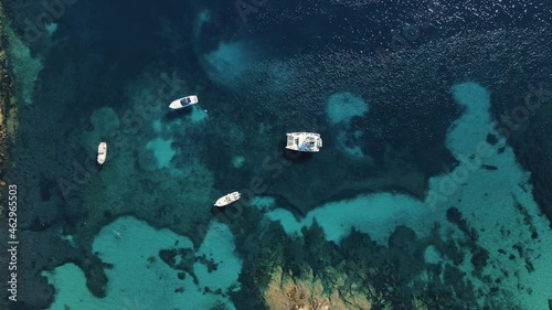 secret sea shore spot with clear water ideal for heartfelt excursion. Boats and sailboats anchor in the little inlet. Heaven scuba jumpers. drone sideways, north Sarinia photo