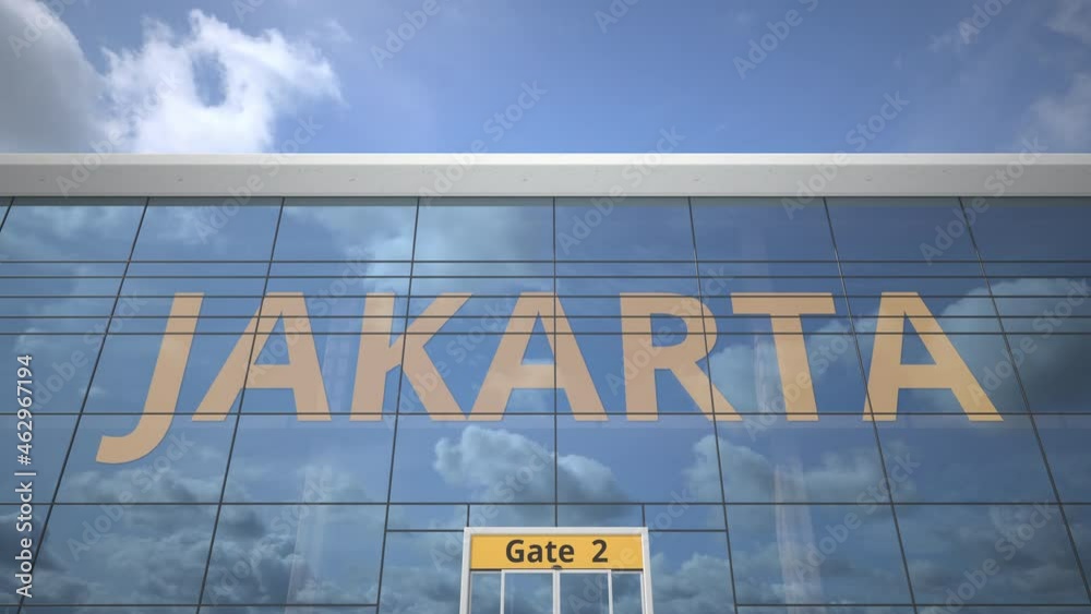 JAKARTA city name and landing airplane at airport terminal