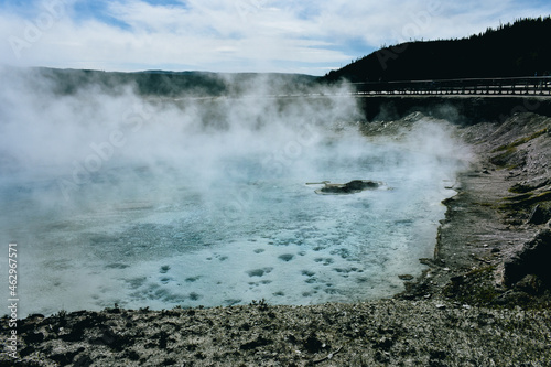 Excelsior Geyser, which located in the Midway Geyser Basin in Yellowstone National Park, drains 4,000-4,500 gallons of water per minute into the Firehole River. photo