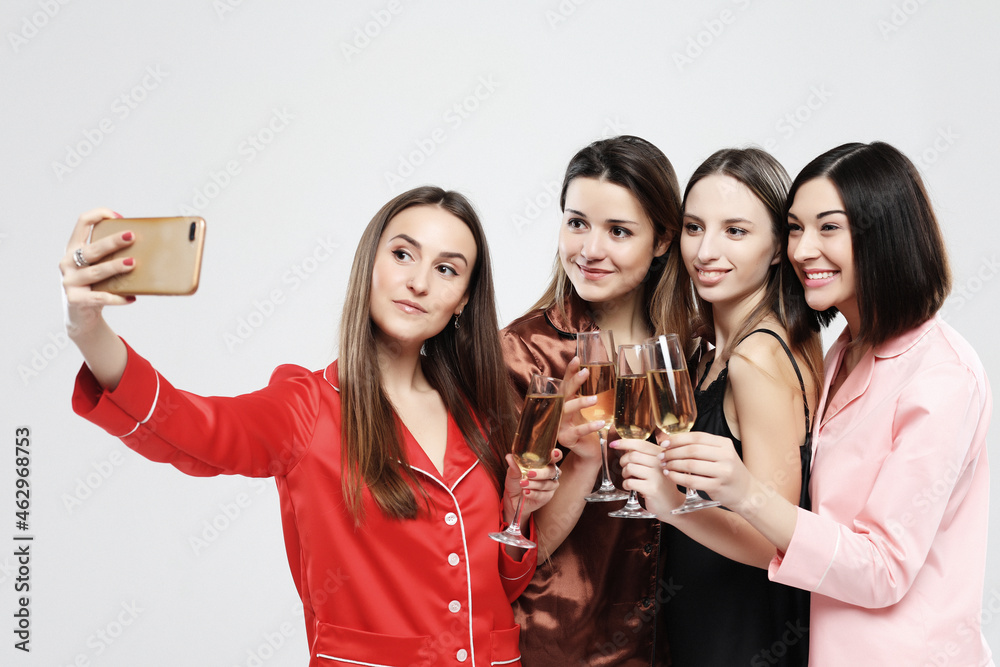 happy friends or teenage girls with smartphone taking selfie over white background happy friends or teenage girls with smartphone taking selfie over white background