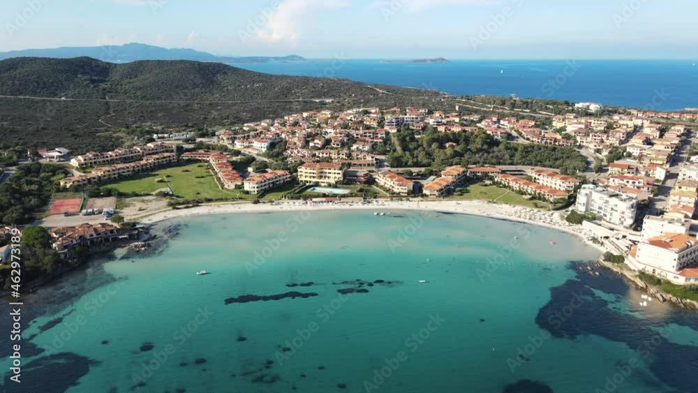 coastal village of Golfo Aranci in northern Sardinia. perfect for vacations, beautiful white sand beaches, clear blue water. Boats anchored on the jetty. drone aerial view, Italy. coastal village of Golfo Aranci in northern Sardinia. perfect for vacations, beautiful white sand beaches, clear blue water. Boats anchored on the jetty. drone aerial view, Italy.