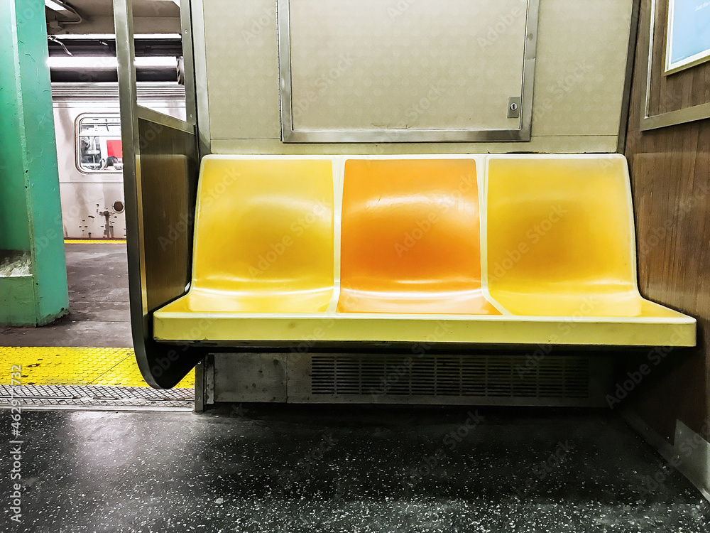 Empty seats in a NYC subway car.