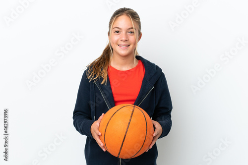 Little caucasian girl isolated on white background playing basketball