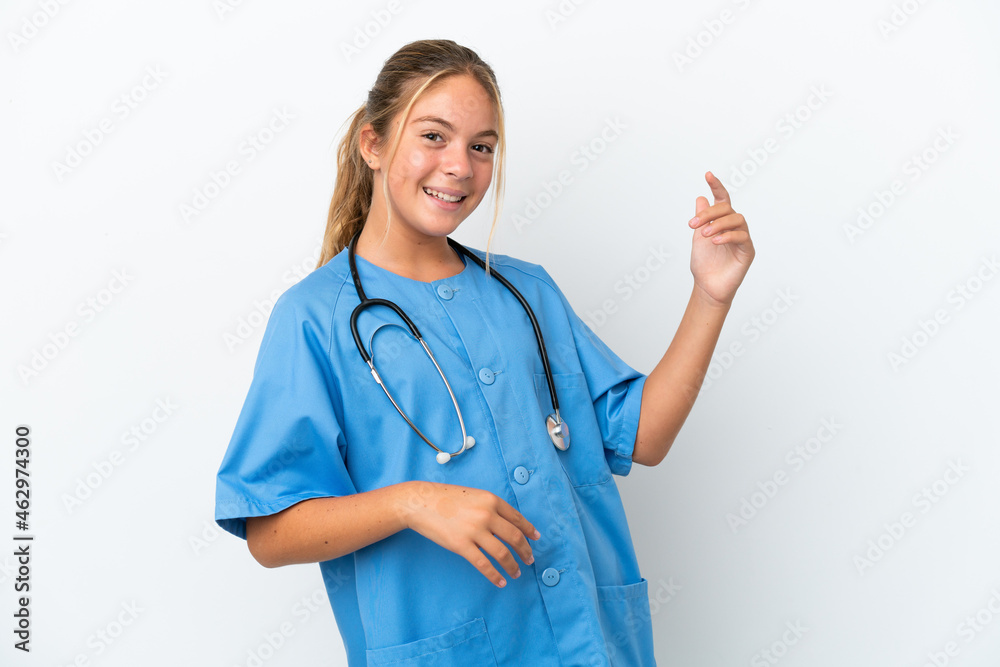 Little caucasian girl disguised as surgeon isolated on white background making guitar gesture Little caucasian girl disguised as surgeon isolated on white background making guitar gesture