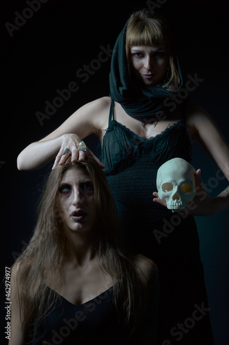 Summoning spell on halloween, witch with mind control powers photo