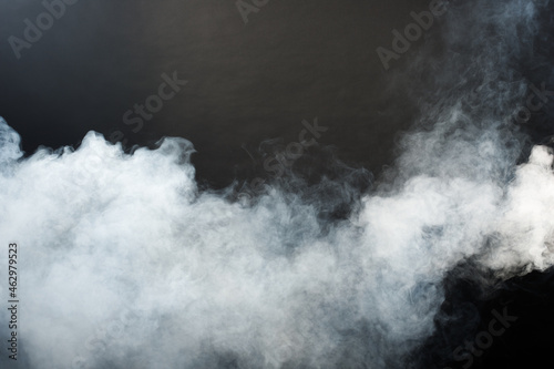 Dense Fluffy Puffs of White Smoke and Fog on Black Background, Abstract Smoke Clouds