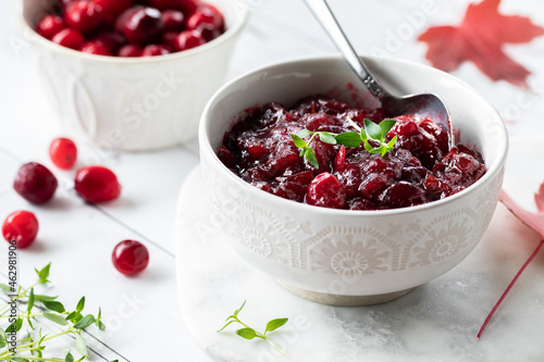A close up view of a bowl of homemade cranberry sauce for Thanksgiving dinner. photo