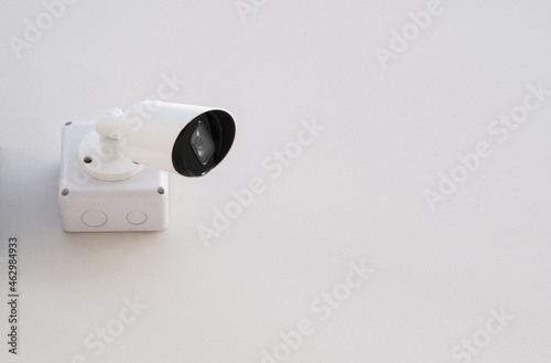 IP CCTV camera install on white concrete wall camera is home security system concept.