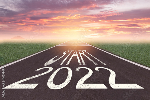 The word start 2022 written on asphalt road at sunrise, New life change 2022 plan concept, Concept for new year 2022,