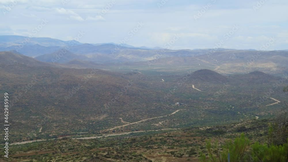 Vista Of Hills And Mountains Over Deserted Countryside Near Jerome In Arizona. Wide Shot Vista Of Hills And Mountains Over Deserted Countryside Near Jerome In Arizona. Wide Shot