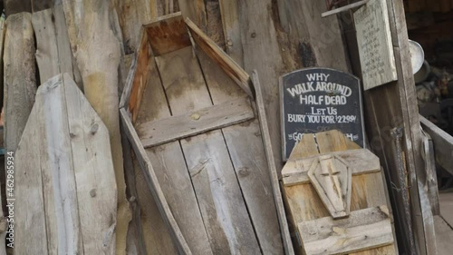 Open Coffin Made Of Wood Displayed At A Scrapyard In Jerome, Arizona. close up photo