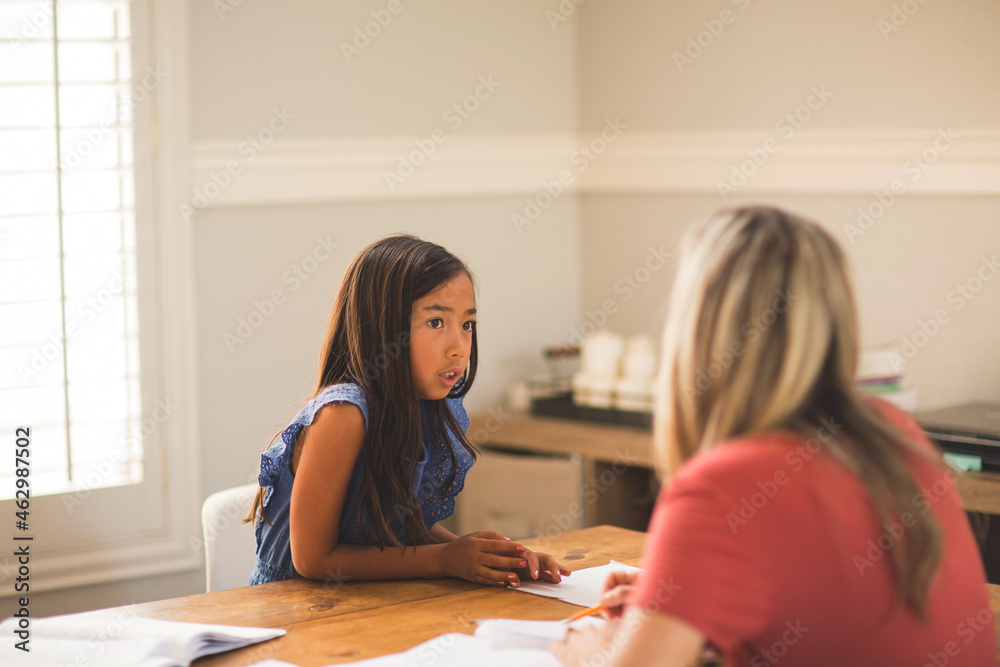 Teacher Helping Her Students With Their Homework School work.