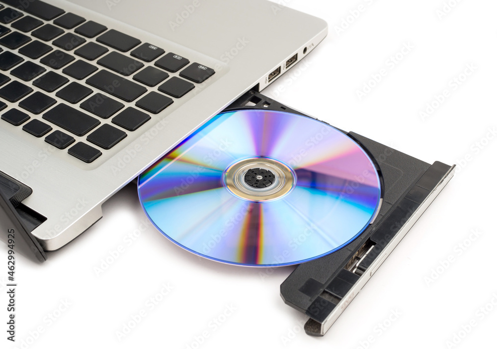 Compact disc drive of computer on white background, selective focus Compact disc drive of computer on white background, selective focus