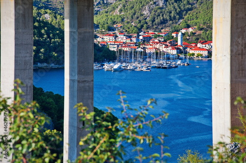 Scenic view of Mediterranean town through the bridge pillars