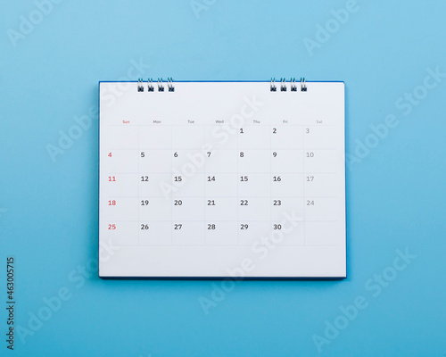 Calendar on a blue background, the concept of planning.