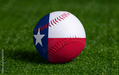 Photography Baseball with Texas flag on green grass background, close up
