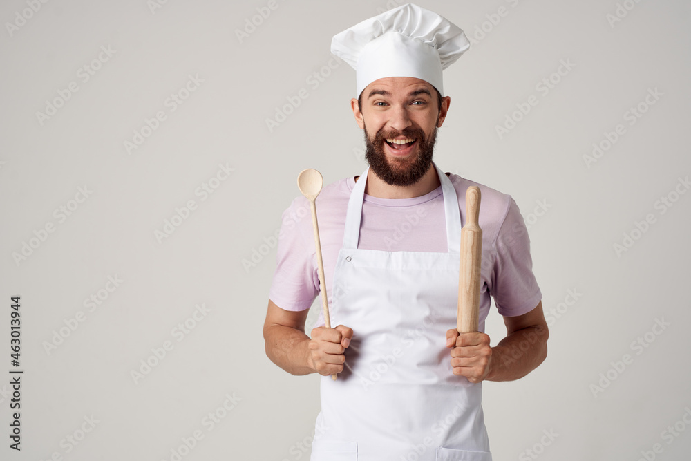 male chef in uniform cooking professional cooking