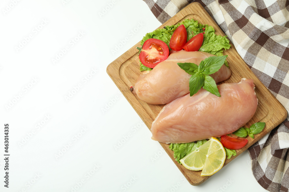 Concept of tasty food with slices of raw chicken fillet on white background Concept of tasty food with slices of raw chicken fillet on white background