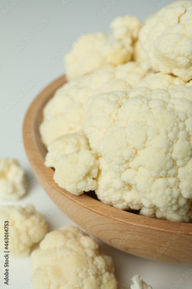 Slices of fresh juicy cauliflower in bowl on white background Slices of fresh juicy cauliflower in bowl on white background