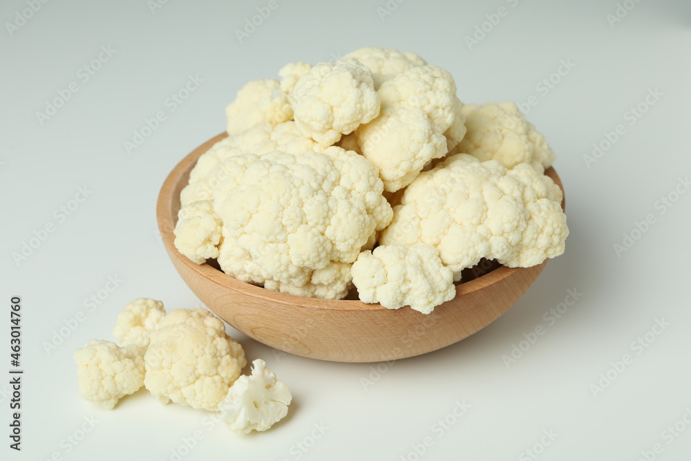 Slices of fresh juicy cauliflower in bowl on white background Slices of fresh juicy cauliflower in bowl on white background