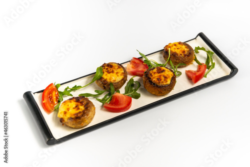 champignons with cheese on a white background