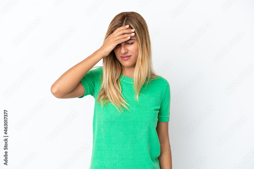 Blonde Uruguayan girl isolated on white background with headache Blonde Uruguayan girl isolated on white background with headache
