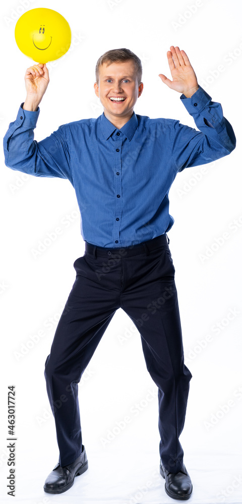 man with a yellow balloon in a business suit in full growth on a white background