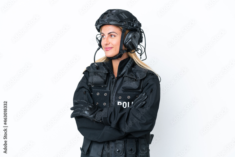 SWAT caucasian woman isolated on white background looking side SWAT caucasian woman isolated on white background looking side
