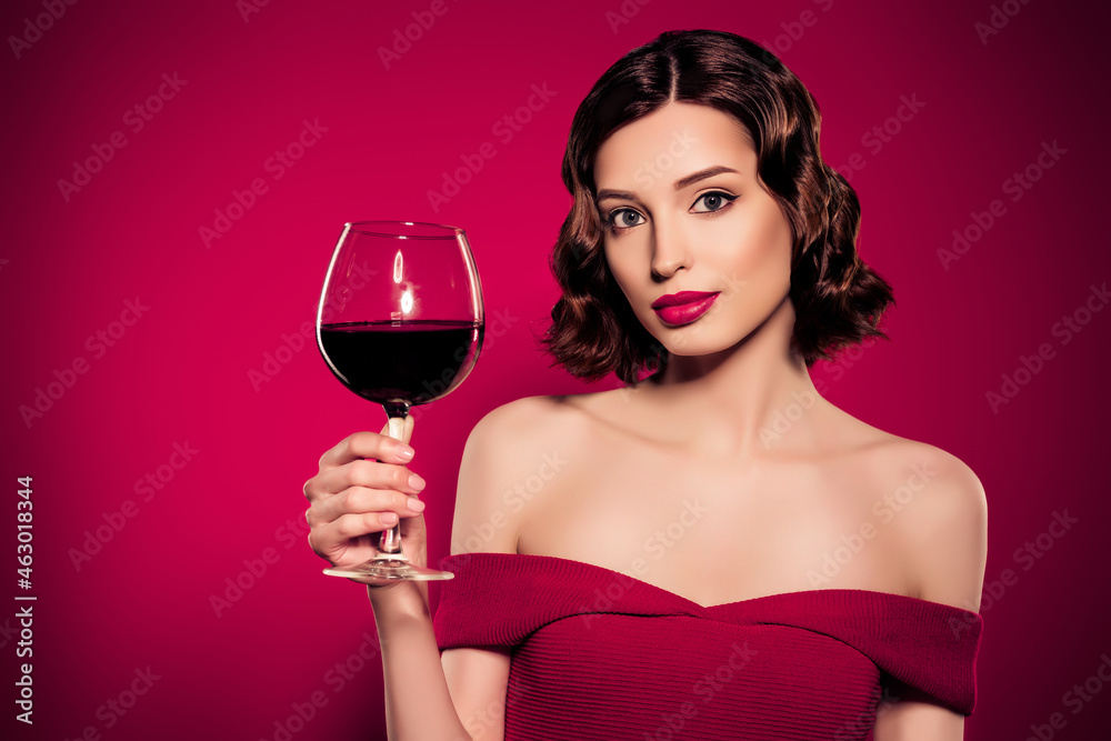 Tender photo of stunning female model hold hand wine glass drink holiday mood tender face isolated on red color background Tender photo of stunning female model hold hand wine glass drink holiday mood tender face isolated on red color background