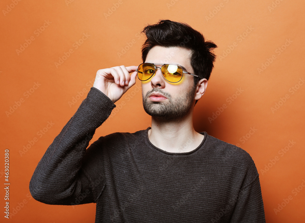 Fototapeta premium Handsome young man in smart casual wear with sunglasses