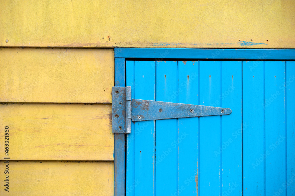 Blue door on yellow wall Blue door on yellow wall