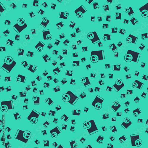 Black Audio book icon isolated seamless pattern on green background. Book with headphones. Audio guide sign. Online learning concept. Vector