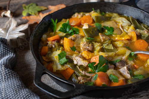 Autumn stew with vegetables, pumpkin, potatoes, green beans and pork meat cooked with pork ribs
