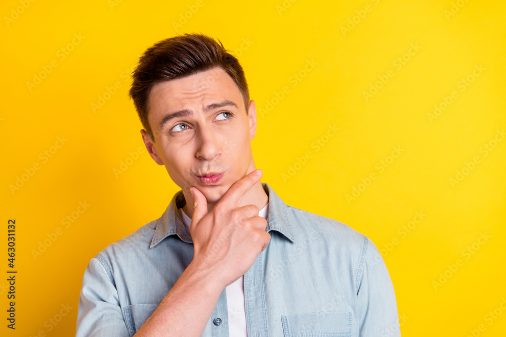 Photo of young serious nice looking man guy look copyspace thinking brainstorming isolated on yellow color background Photo of young serious nice looking man guy look copyspace thinking brainstorming isolated on yellow color background